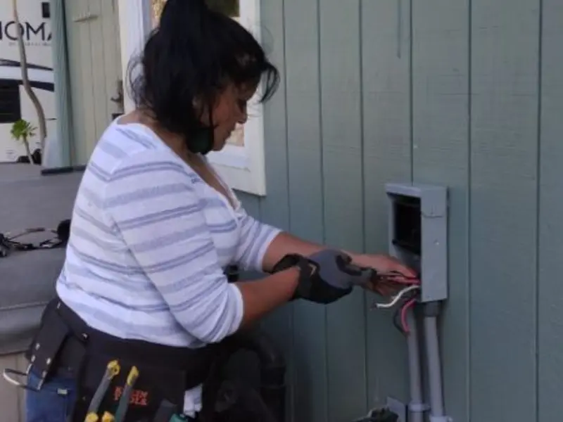 Licensed electrician wiring an exterior subpanel in Port Ludlow