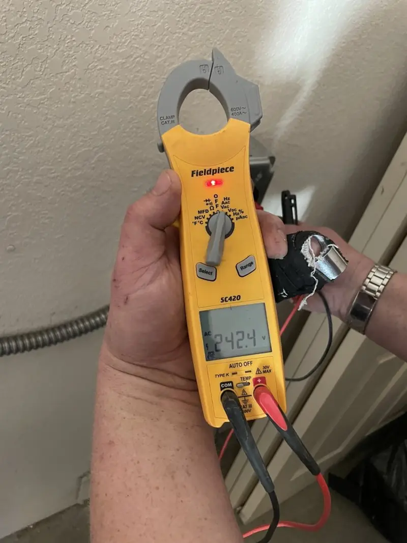 Voltage testing with clamp meter during Electrical Installation Services in Port Ludlow